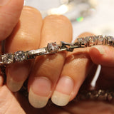 Bracciale Tennis in argento rodiato regolabile con Zirconi Bianchi Amen