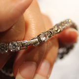 Bracciale Tennis in argento rodiato regolabile con Zirconi Bianchi Amen